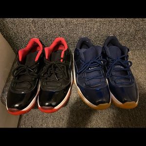 Navy Jordan XI low tops.